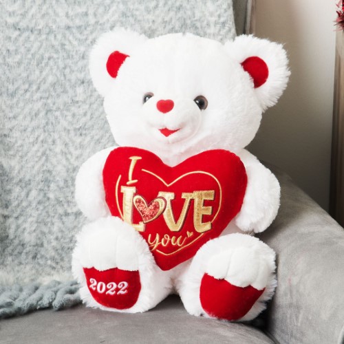 Oso de peluche blanco con corazón y mensaje